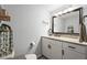 Bright bathroom with a granite vanity, modern fixtures, and a decorative mirror, creating a clean, fresh ambiance at 4311 2Nd E Ave, Bradenton, FL 34208
