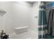 This bathroom showcases a tiled shower/tub combo with a shower head and built in seat at 4311 2Nd E Ave, Bradenton, FL 34208