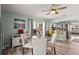 Charming dining area with a round table, comfortable seating, and direct access to both the kitchen and outdoor patio at 4311 2Nd E Ave, Bradenton, FL 34208