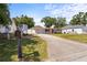 Charming single-story home with an anchor detail, red door, and a spacious front yard at 4311 2Nd E Ave, Bradenton, FL 34208