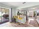 Open kitchen featuring a breakfast bar with seating, stainless steel appliances, and sliding door to the deck at 4311 2Nd E Ave, Bradenton, FL 34208