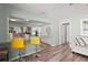 Open-concept kitchen with granite countertops, modern appliances, and bar seating that seamlessly connects to the living space at 4311 2Nd E Ave, Bradenton, FL 34208