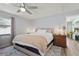 Comfortable bedroom with a ceiling fan, bedside tables, and an inviting bed with plush bedding at 4311 2Nd E Ave, Bradenton, FL 34208
