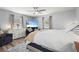 This main bedroom features a ceiling fan, TV, closet, windows, and a seating area at 4311 2Nd E Ave, Bradenton, FL 34208