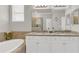 Bright bathroom with a double sink vanity, granite counters and a soaking tub at 4406 Baltry Ct, Bradenton, FL 34211