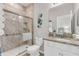 This bathroom features a tiled shower, granite countertop, and neutral colors at 4406 Baltry Ct, Bradenton, FL 34211