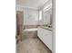 Inviting bathroom featuring a soaking tub, tiled shower, and double sinks at 4406 Baltry Ct, Bradenton, FL 34211