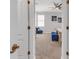 View of bedroom through doorway, featuring neutral carpet, light gray walls, and a ceiling fan at 4406 Baltry Ct, Bradenton, FL 34211
