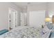 This bedroom features a coastal theme, ensuite bath, and a spacious closet at 4406 Baltry Ct, Bradenton, FL 34211