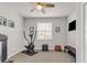 A bright exercise room features an elliptical machine, bench, ceiling fan, and natural lighting at 4406 Baltry Ct, Bradenton, FL 34211