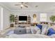Bright living room with a ceiling fan and modern decor at 4406 Baltry Ct, Bradenton, FL 34211