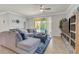 Cozy living room with a view of the pool and access to the patio at 4406 Baltry Ct, Bradenton, FL 34211