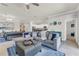 Spacious living room featuring a sectional sofa, tile flooring and neutral paint colors at 4406 Baltry Ct, Bradenton, FL 34211