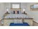 Comfortable main bedroom featuring a decorative bed, neutral carpet, and light gray and white walls at 4406 Baltry Ct, Bradenton, FL 34211