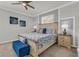 Comfortable main bedroom featuring a decorative bed, neutral carpet, and light gray and white walls at 4406 Baltry Ct, Bradenton, FL 34211