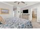 Large main bedroom with neutral carpet, light gray walls, and a flat screen tv at 4406 Baltry Ct, Bradenton, FL 34211