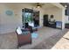 Inviting covered patio with a ceiling fan and outdoor seating area at 4406 Baltry Ct, Bradenton, FL 34211