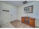 Cozy entryway featuring a modern door, rich wood floors, stylish furniture, and decorative artwork at 441 Venetia Ave, North Port, FL 34287
