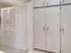 Hallway featuring white storage cabinets at 441 Venetia Ave, North Port, FL 34287