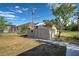 Metal storage shed in backyard with fence at 441 Venetia Ave, North Port, FL 34287