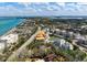 An aerial shot shows the home's ideal location within an active community and close to the pristine beach at 4711 Ocean Blvd, Sarasota, FL 34242