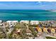 An aerial shot of the property, nestled between local businesses and white sandy beaches, perfect for enjoying the ocean at 4711 Ocean Blvd, Sarasota, FL 34242