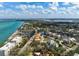 An aerial view of the home in a location near the beach and other homes within a residential community at 4711 Ocean Blvd, Sarasota, FL 34242