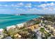 This aerial view highlights the ideal location near a picturesque beach and an active residential community at 4711 Ocean Blvd, Sarasota, FL 34242