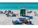 An inviting view of the beach with a lifeguard stand, beachgoers, and blue waters at 4711 Ocean Blvd, Sarasota, FL 34242