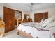 Inviting bedroom showcases a decorative quilt, wood furniture, and closet space at 4711 Ocean Blvd, Sarasota, FL 34242