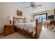Comfortable bedroom featuring a cozy bed, ceiling fan, and sliding glass doors at 4711 Ocean Blvd, Sarasota, FL 34242