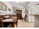 View of a wood dining table with seating and a vintage china cabinet in an eat-in kitchen at 4711 Ocean Blvd, Sarasota, FL 34242