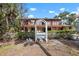 Lovely two-story home with a pool, balconies, and beautiful landscape at 4711 Ocean Blvd, Sarasota, FL 34242