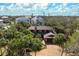 Charming home featuring mature landscaping with a long driveway and a two car garage at 4711 Ocean Blvd, Sarasota, FL 34242