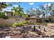 Beautiful two-story home with tropical landscaping and water feature at 4711 Ocean Blvd, Sarasota, FL 34242