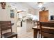 Functional kitchen with white cabinetry, dining area and updated flooring at 4711 Ocean Blvd, Sarasota, FL 34242