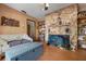 View of the living room featuring a stone fireplace and a built in bookshelf at 4711 Ocean Blvd, Sarasota, FL 34242