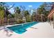 Backyard paradise with a beautiful pool and lush landscaping at 4711 Ocean Blvd, Sarasota, FL 34242
