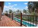 Balcony overlooks the beautiful pool and landscape with serene surroundings at 4711 Ocean Blvd, Sarasota, FL 34242