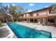 Stunning pool with lounge chairs, complemented by an open patio and a balcony overlooking the yard at 4711 Ocean Blvd, Sarasota, FL 34242