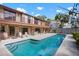 Beautiful outdoor pool with patio surrounded by lounge chairs, with a balcony view overlooking the area at 4711 Ocean Blvd, Sarasota, FL 34242