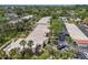 Aerial view of a residential neighborhood with mature landscaping, manicured lawns, and assigned parking at 510 Spring Lakes Blvd, Bradenton, FL 34210