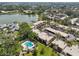 Aerial view of a community with a pool, lake and landscaped grounds, offering a picturesque setting at 510 Spring Lakes Blvd, Bradenton, FL 34210