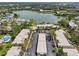 Aerial view of a residential community with views of a large lake, a swimming pool and city views at 510 Spring Lakes Blvd, Bradenton, FL 34210