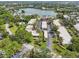Aerial view of apartments, highlighted by verdant landscaping and winding roads at 510 Spring Lakes Blvd, Bradenton, FL 34210