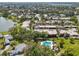 Lovely aerial view showcasing a beautiful community with a swimming pool and lush landscaping at 510 Spring Lakes Blvd, Bradenton, FL 34210
