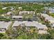 An aerial view of apartments with well-kept parking areas and surrounding greenery at 510 Spring Lakes Blvd, Bradenton, FL 34210