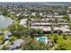 Aerial view of a neighborhood featuring a community pool, lake access, and lush landscaping at 510 Spring Lakes Blvd, Bradenton, FL 34210