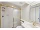 Bathroom featuring shower, vanity, sink and mirror with tiled walls and gold frame at 510 Spring Lakes Blvd, Bradenton, FL 34210