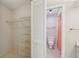 Bathroom with a linen closet, wire shelves, and a separate water closet with shower at 510 Spring Lakes Blvd, Bradenton, FL 34210